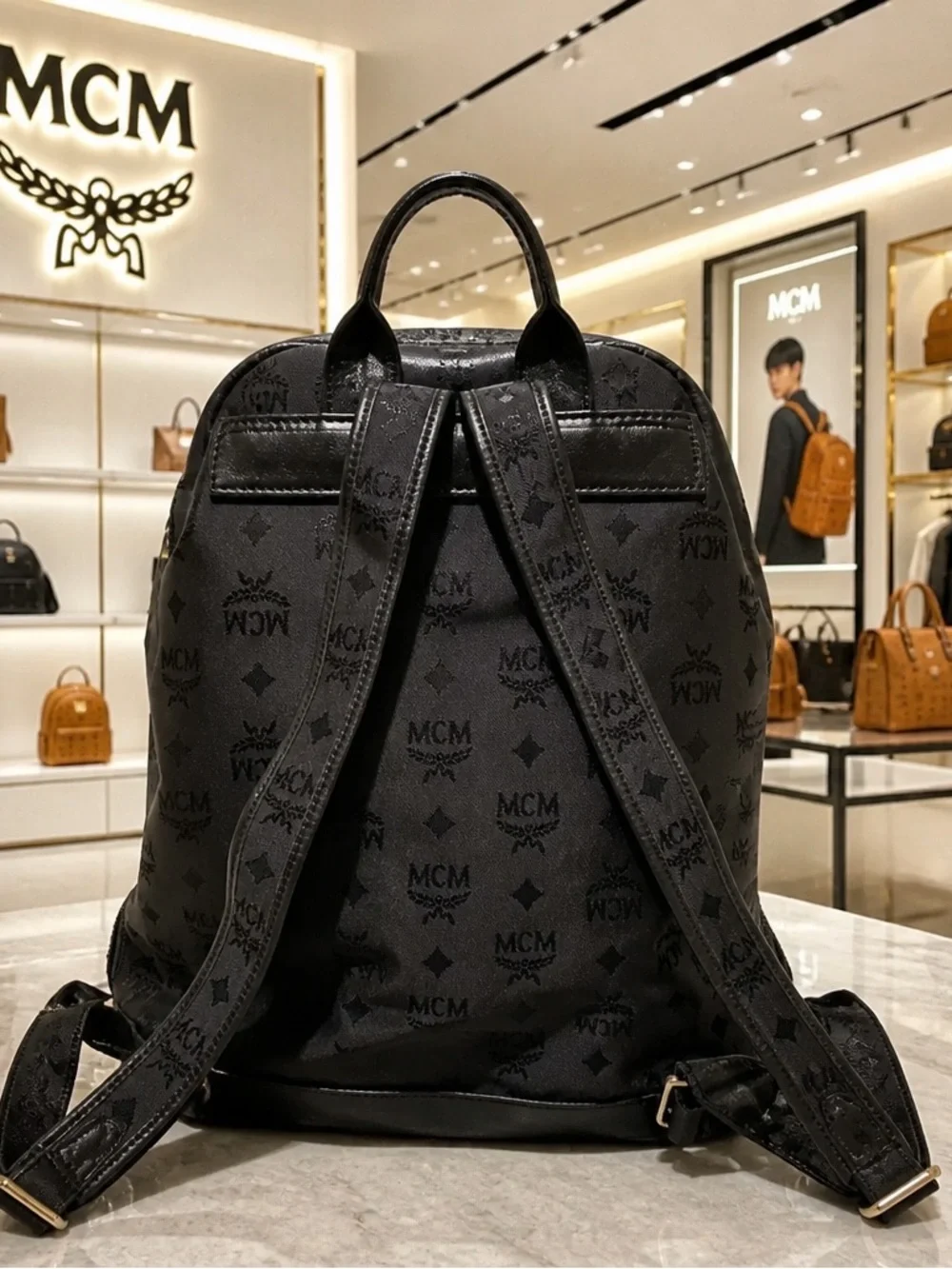 MCM Black Monogram Backpack with Gold-Plated Detail